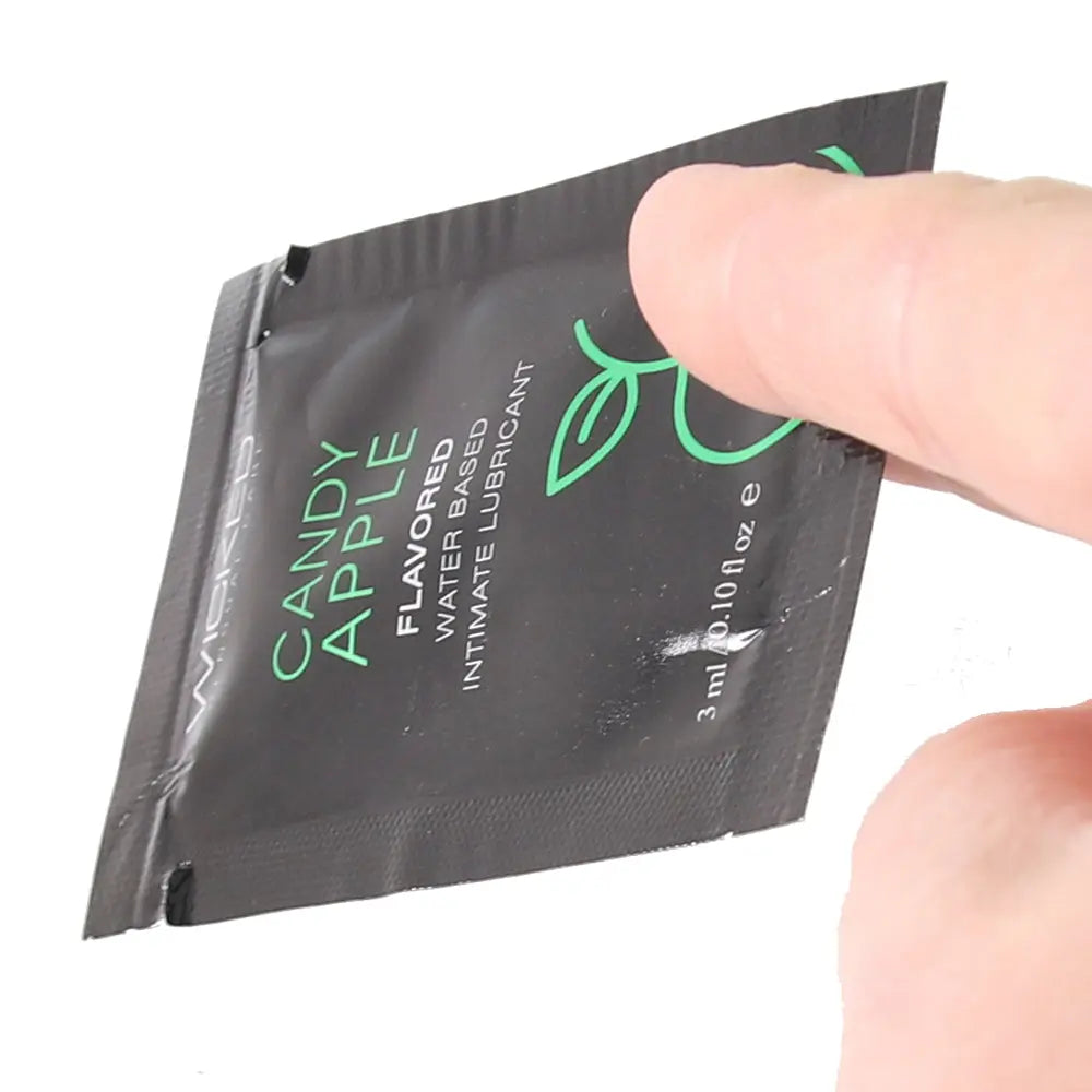 Aqua Flavored Lube in Candy Apple in hand Sex Toys Calgary Same-Day Delivery